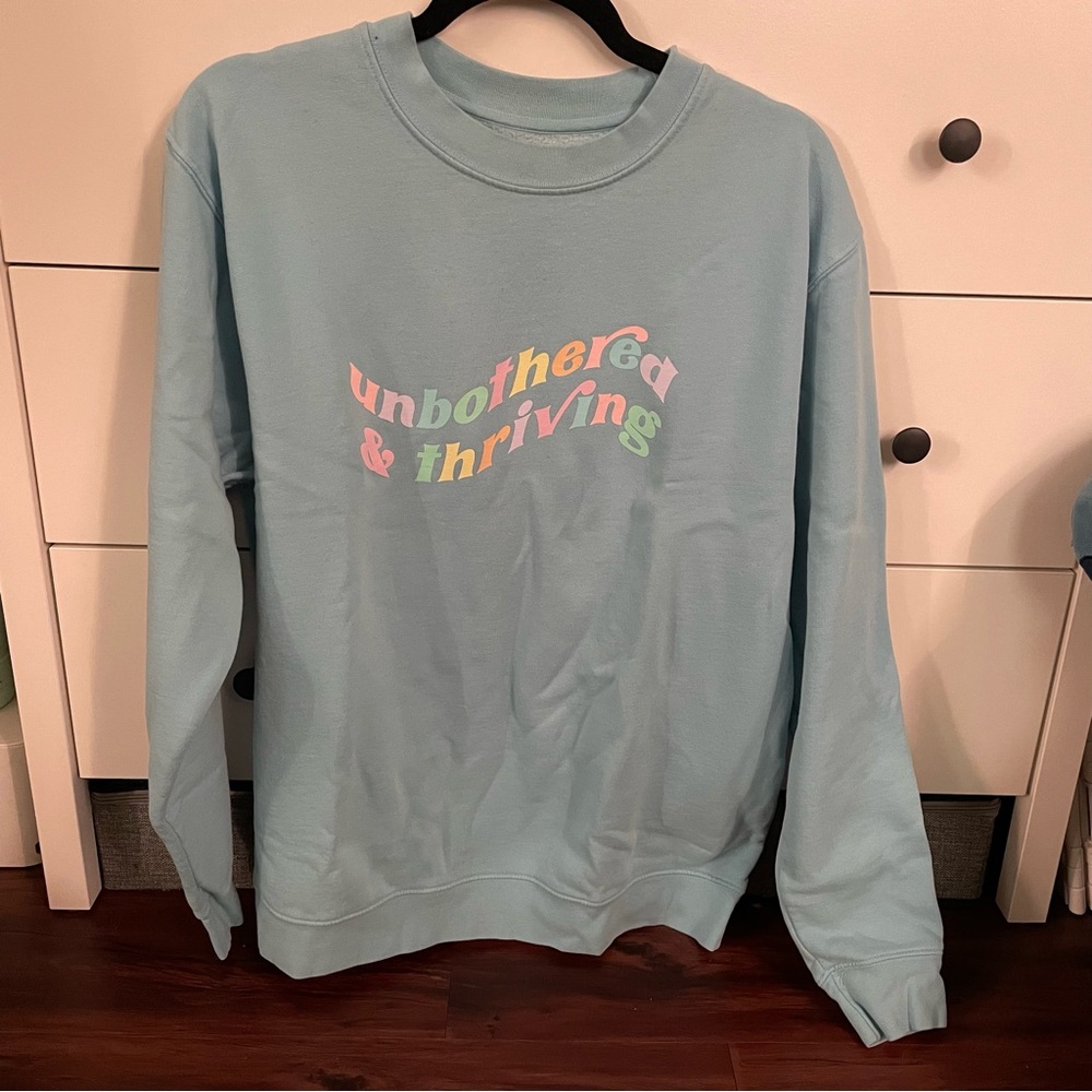 Remi Cruz Unbothered and Thriving Crewneck